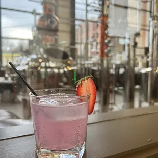 strawberry fields with a view into the distilling process