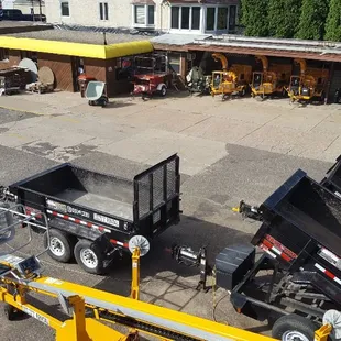 A glimpse of our boomlifts and dump trailers.