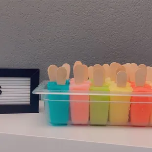 a plastic container filled with pops