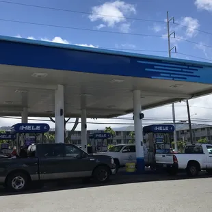 a truck parked in front of a gas station