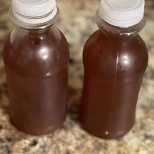 two bottles of hot sauce
