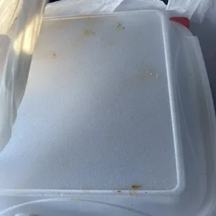 a white plastic container with a plastic lid