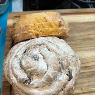 Olive rosemary bread and sliced tomato basil bread