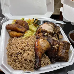 Large jerk chicken, rice and peas, steamed vegetables and plantains.