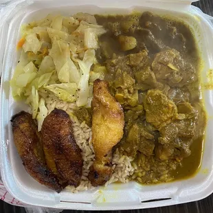 Curried Goat, Steamed Vegetables, Plantain, Rice and Peas