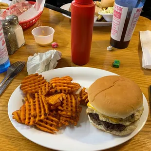 a hamburger and fries on a plate