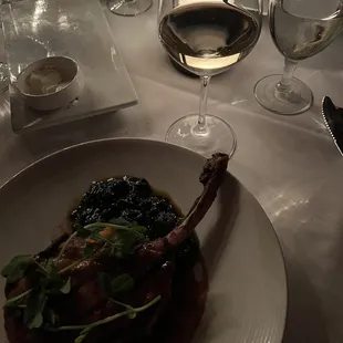 Grilled Tomahawk Pork chop with Braised Greens and Sweet Potato Mash