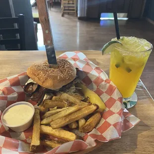 Mushroom bacon Swiss burger with hand, cut fries