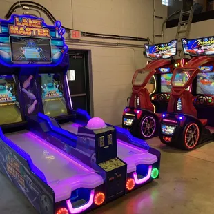 two arcade machines in a garage