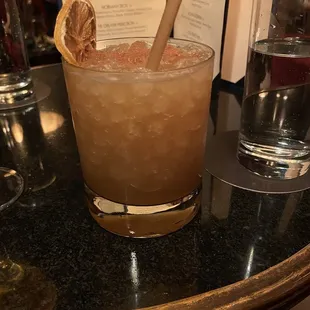 a drink with a spoon in it
