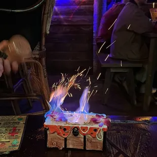 a man cutting a cake with a knife