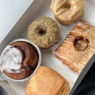 vegan biscuit, vegan cinnamon roll, vegan apple pop tart, pumpkin crunch doughnut, and maple miso doughnut