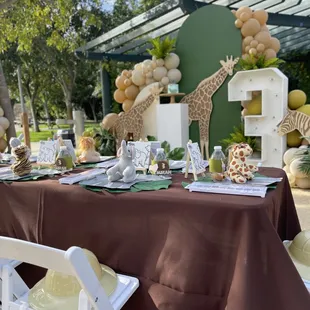Kids paint party and display with backdrops, balloons + greenery, marquees and giraffe wood prop