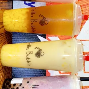 Strawberry smoothie w/ boba, mango green tea w/ mango jelly, mango green milk tea w/ mango jelly, last one is a berry smoothie w/ boba