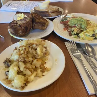 Omelet,  fried potatoes, cranberry nut muffin. Fresh squeezed orange juice