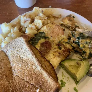 Salmon omelette with avocado and home fries