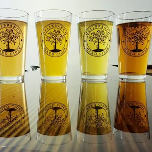 four glasses of cider