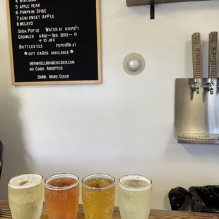 four glasses of cider