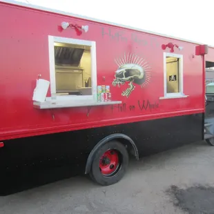 a food truck with a skull painted on the side