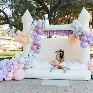 12x10 white bounce house with balloon decor