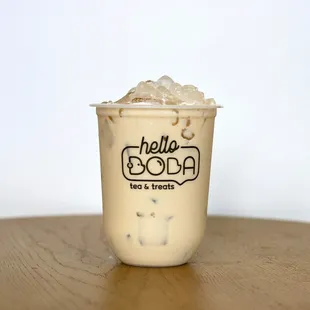 a cup of iced coffee on a table