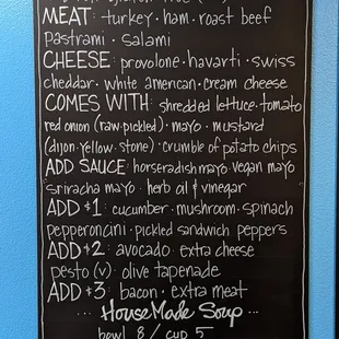a menu on a blue wall