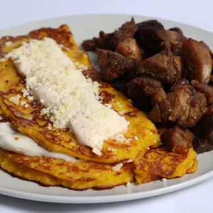 Corn pancakes with paisa caribbean cheese and fried pork.