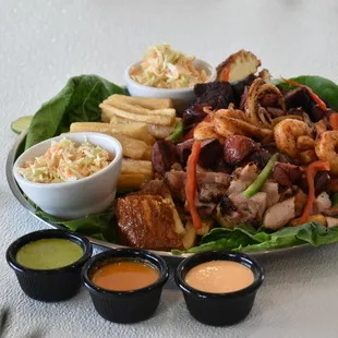 Grilled beef and chicken, sauteed with green and red pepper, served with chorizo, fried cheese, coleslaw and fried yuca.