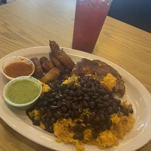 1/4 Chicken with rice and beans and plantains...Blackberry homemade juice. So good
