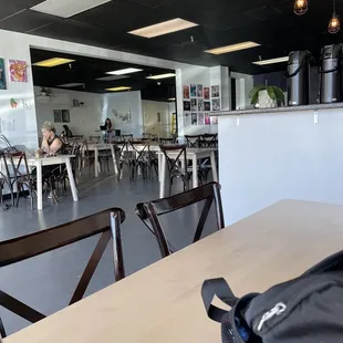 a table and chairs in a coffee shop