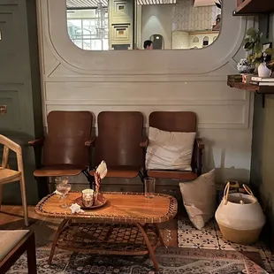 a living room with two chairs and a coffee table