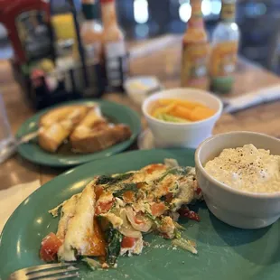 Veggie O Omelet! Egg whites, onions, bell peppers, and baby spinach. Comes with a fruit cup and cottage cheese! What's not to love?
