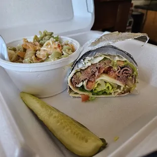 This is a delicious Roast beef wrap with quacamole. Side of the pasta salad.