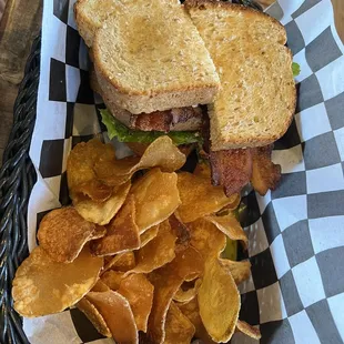 a basket of chips and a sandwich