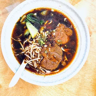 a bowl of soup on a wooden table