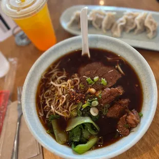 Braised beef noodle soup  Pork with Napa Cabbage Dumplings Mango tea