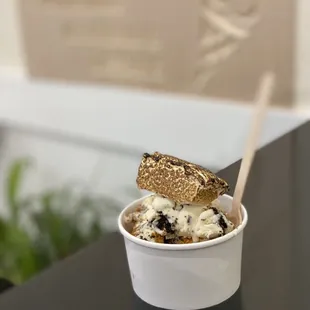 a cup of ice cream and a bagel