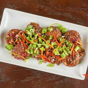 a plate of food with meat and vegetables