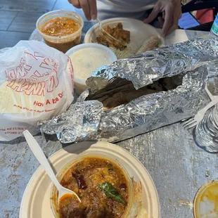 Chicken Vindaloo in the front and Butter Chicken in the back.