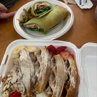 a plate of food and a plate of fruit