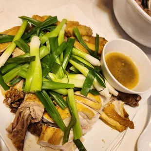 Steamed chicken on a bed of rock salt.