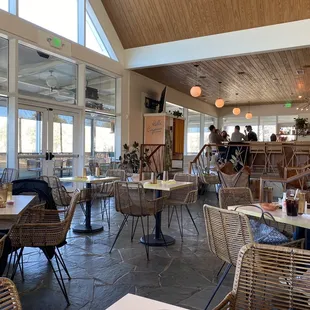 Great view of the water, open floor plan, light filled dining room.