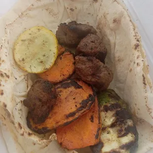 One Kabob skewer with veg and pita. Cost $8.99 plus tax burnt onions not pictured