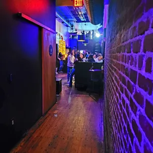 Pathway to maintain bar from backroom, bathrooms on left