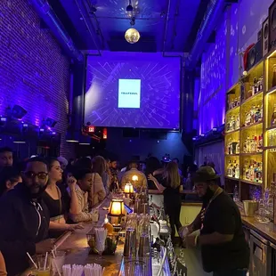 a group of people at a bar