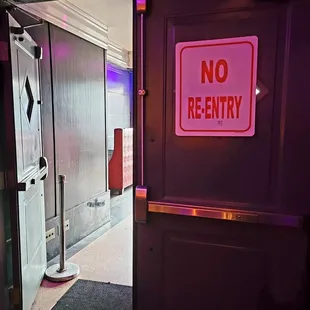 They stamped my wrist when I entered, but the sign says, "No Entry".