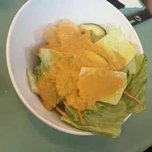 Salad with ginger dressing. It has pineapples in it for anyone who is allergic.