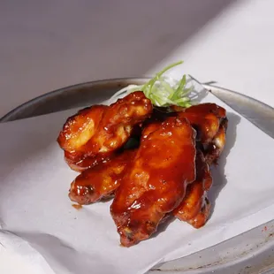 a plate of chicken wings