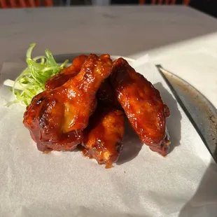 a plate of chicken wings on a table