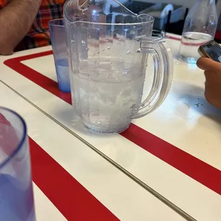 a pitcher of water on a table